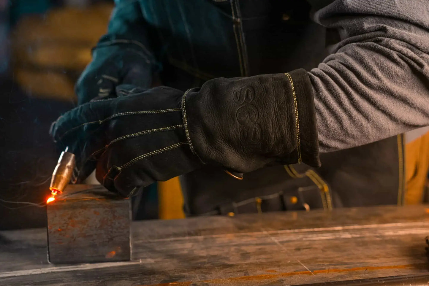 1898 Leather welding gloves with gold thread in action — shown during welding for maximum protection, flexibility, and grip, rated 4.7 stars - Gold
