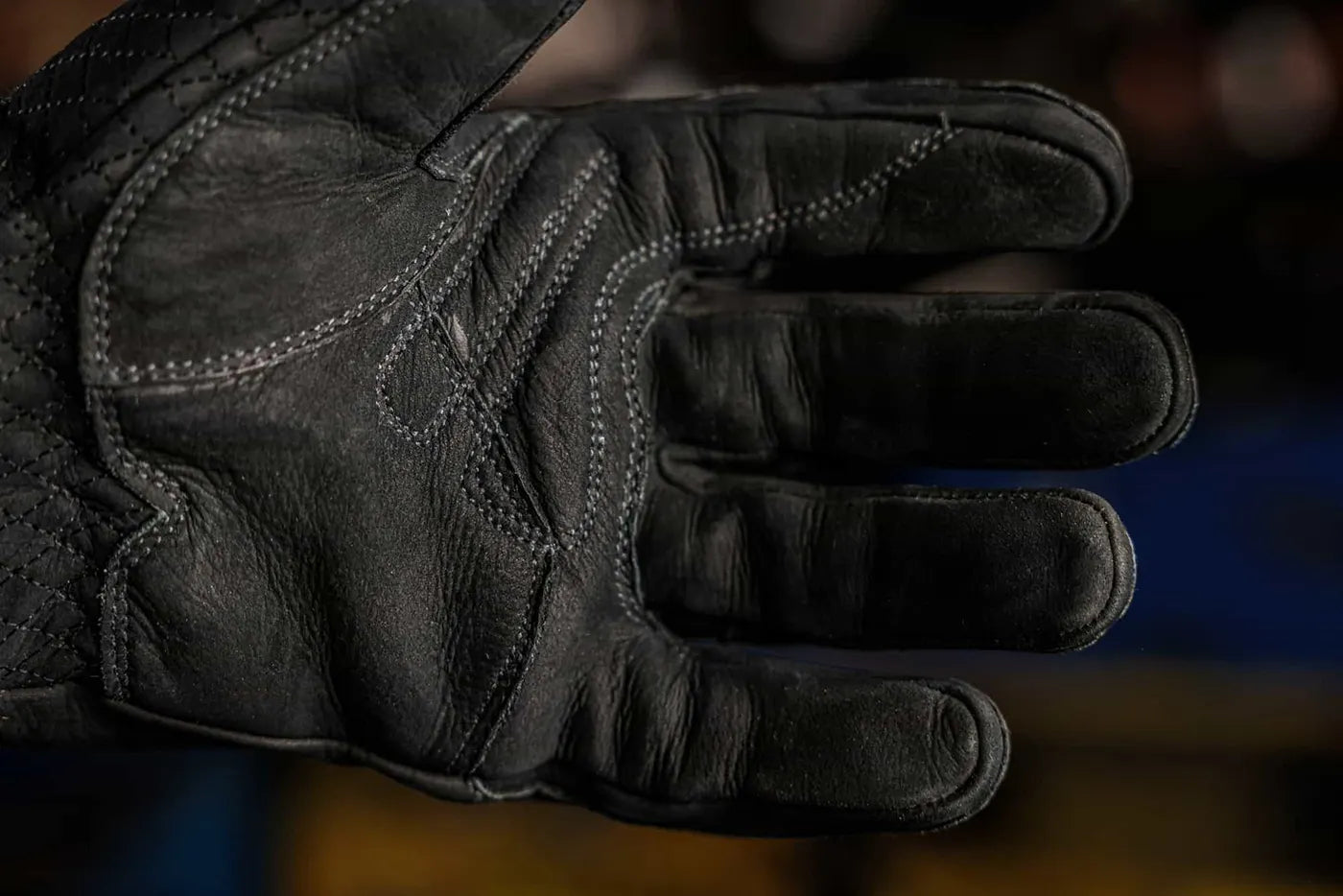 Close up of black-thread leather work glove showing reinforced palm stitching and textured leather surface, highlighting grip, durability, and craftsmanship Rated 4.70 – Black