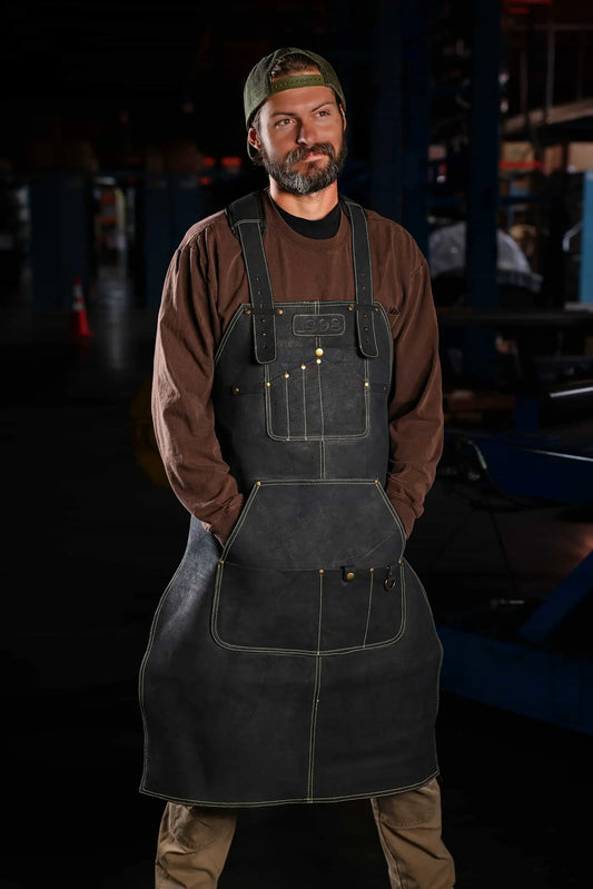 Regular model wearing heavy duty leather welding apron with gold thread, front view, durable protective welding gear apron, rated 4.85 - Gold