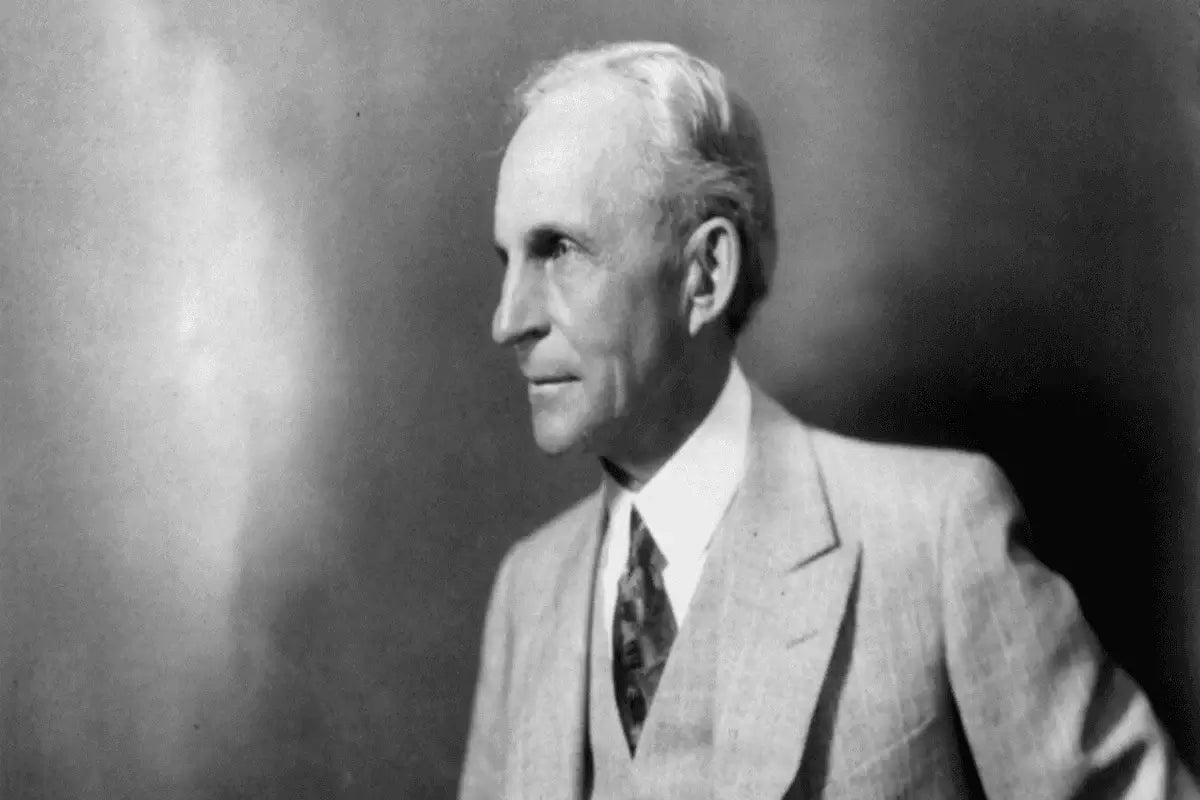 Black and white portrait of Henry Ford in a light three-piece suit
