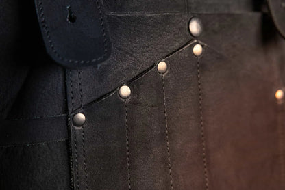 Close-up of rivets on 1898 Leather welding apron with black thread detailed view showcasing durability and craftsmanship, rated 4.85 stars - Black