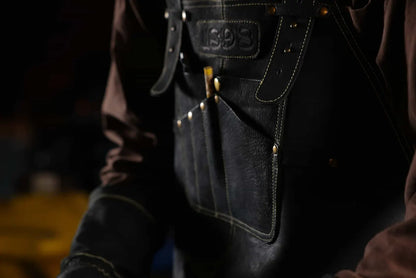 Close-up of 1898 Leather welding apron with gold thread on neck strap and detailed chest pockets premium quality, 4.85-star rated apron designed for durability and convenience - Gold