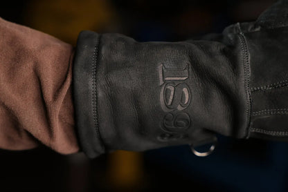 Close up of black-thread leather work glove with “1898” logo embossing and visible stitching, highlighting premium leather texture and craftsmanship – Rated 4.70 – Black