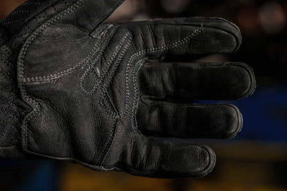 Close up of black-thread leather work glove showing reinforced palm stitching and textured leather surface, highlighting grip, durability, and craftsmanship  Rated 4.70 – Black